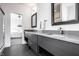 Modern bathroom features gray vanity with double sinks and a separate shower and bedroom space at 1622 Cornell Ave, Indianapolis, IN 46202