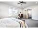 Bright bedroom with a sliding barn door, neutral walls and gray carpet at 1622 Cornell Ave, Indianapolis, IN 46202