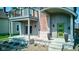 Contemporary home with a welcoming front porch and modern green front door at 1622 Cornell Ave, Indianapolis, IN 46202