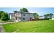 Beautiful exterior view of a modern home with a green lawn and tasteful landscaping, creating curb appeal at 1622 Cornell Ave, Indianapolis, IN 46202