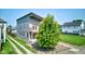 Modern home with a balcony, a tree in the yard, and clean architectural lines at 1622 Cornell Ave, Indianapolis, IN 46202