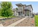 Striking two-story home featuring a modern design with a balcony and a professionally landscaped front yard at 1622 Cornell Ave, Indianapolis, IN 46202