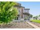 Charming two-story home with a welcoming covered entryway and a lush green tree in the front yard at 1622 Cornell Ave, Indianapolis, IN 46202
