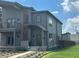 Modern two-story home featuring neutral siding, stone accents, manicured landscaping, and an inviting arched entryway at 1622 Cornell Ave, Indianapolis, IN 46202