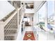 Contemporary foyer with staircase, metal railings, high ceilings, and view into the dining and living spaces at 1622 Cornell Ave, Indianapolis, IN 46202