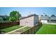 This is a detached garage with a well-kept lawn and a wooden fence at 1622 Cornell Ave, Indianapolis, IN 46202