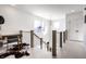 Bright hallway with wood floors, modern railing, and a built-in desk at 1622 Cornell Ave, Indianapolis, IN 46202