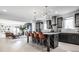 This stunning kitchen features dark cabinets, a central island with seating, and an open-concept design at 1622 Cornell Ave, Indianapolis, IN 46202