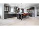 Spacious kitchen with stainless steel appliances, dark cabinetry, a large island, and modern lighting at 1622 Cornell Ave, Indianapolis, IN 46202