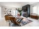 Modern living room featuring a stylish chair, fireplace, and open layout with ample natural light at 1622 Cornell Ave, Indianapolis, IN 46202