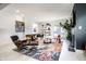 Contemporary living room with modern seating, stylish decor, fireplace, and an open, airy layout at 1622 Cornell Ave, Indianapolis, IN 46202