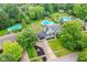 Aerial view showcasing a lovely home with an in-ground pool and lush greenery at 164 Wellington Pkwy, Noblesville, IN 46060