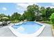 Large backyard pool with steps, a diving board, and concrete pool surround offers space for recreation and relaxation at 164 Wellington Pkwy, Noblesville, IN 46060