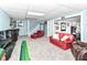 Finished basement with a recreation area and custom bar; ideal for entertaining guests at 164 Wellington Pkwy, Noblesville, IN 46060