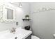 Charming bathroom with a decorative mirror, grey walls, and a modern sink at 164 Wellington Pkwy, Noblesville, IN 46060