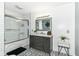 Modern bathroom with tile flooring, glass shower, and a stylish vanity at 164 Wellington Pkwy, Noblesville, IN 46060
