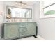 Stylish bathroom with double sinks, a decorative vanity, and a large mirror at 164 Wellington Pkwy, Noblesville, IN 46060