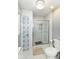 Well-lit bathroom featuring a glass shower and decorative tile work at 164 Wellington Pkwy, Noblesville, IN 46060
