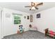 Cozy bedroom with window and plush carpet; a comfortable and inviting space at 164 Wellington Pkwy, Noblesville, IN 46060