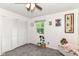 Bright bedroom with a window, plush carpet, and a spacious closet at 164 Wellington Pkwy, Noblesville, IN 46060