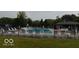 Community pool surrounded by lounge chairs and a fence for safety and privacy at 164 Wellington Pkwy, Noblesville, IN 46060