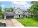 Beautiful exterior elevation showcasing a well-maintained home with a lush green lawn and ample curb appeal at 164 Wellington Pkwy, Noblesville, IN 46060
