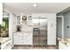 Modern kitchen with stainless steel refrigerator and granite countertops at 164 Wellington Pkwy, Noblesville, IN 46060