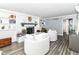 Cozy living room with white brick fireplace, built-in shelves, and inviting, oversized comfortable seating at 164 Wellington Pkwy, Noblesville, IN 46060