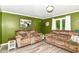 Inviting living room featuring comfortable recliners and lots of natural light at 164 Wellington Pkwy, Noblesville, IN 46060