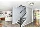 Entry way with staircase, modern color scheme, leading to an upper level and adjacent living spaces at 164 Wellington Pkwy, Noblesville, IN 46060