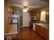 Functional kitchen with light oak cabinets, stainless appliances, and hardwood floors at 213 S Coventry Dr, Anderson, IN 46012