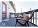 Comfortable balcony featuring chairs with pillows and a view of the exterior at 2230 N Pennsylvania N St # 7, Indianapolis, IN 46205