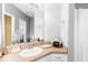 Bright bathroom featuring a single sink vanity with a large mirror and modern fixtures at 2230 N Pennsylvania N St # 7, Indianapolis, IN 46205