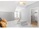 Cozy bedroom featuring soft natural light, with tray of towels on the bed at 2230 N Pennsylvania N St # 7, Indianapolis, IN 46205