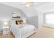 Comfortable bedroom featuring natural light, carpet flooring and neutral wall color at 2230 N Pennsylvania N St # 7, Indianapolis, IN 46205