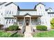 Inviting gray two-story home with covered porch and manicured landscaping at 2230 N Pennsylvania N St # 7, Indianapolis, IN 46205