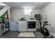 Finished basement area with laundry, exercise equipment and updated appliances at 250 N 18Th Ave, Beech Grove, IN 46107