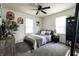 Cozy bedroom features gray carpet, two bright windows, and nice decor at 250 N 18Th Ave, Beech Grove, IN 46107