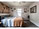 Bright bedroom features a modern ceiling fan, gray carpet, and two windows to allow natural light at 250 N 18Th Ave, Beech Grove, IN 46107