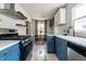 Modern kitchen featuring stainless steel appliances, granite countertops and stylish cabinets at 250 N 18Th Ave, Beech Grove, IN 46107