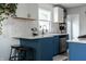 Well-designed kitchen featuring modern white cabinets, marble backsplash, and bar stool seating at 250 N 18Th Ave, Beech Grove, IN 46107
