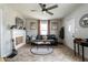 Inviting living room with a decorative fireplace, hardwood floors and large windows at 250 N 18Th Ave, Beech Grove, IN 46107