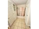 Clean and tidy bathroom featuring a shower-tub combo, tiled floor and ample storage at 2523 S Mcclure St, Indianapolis, IN 46241
