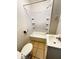 Neat bathroom features shower and tub combination, a white sink, and tiled flooring at 2523 S Mcclure St, Indianapolis, IN 46241
