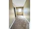 Small bedroom with a window and tan walls with a door leading out to the hallway and brown carpet at 2523 S Mcclure St, Indianapolis, IN 46241
