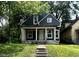 Charming two-story home with a covered front porch and freshly painted exterior at 2955 N Olney St, Indianapolis, IN 46218
