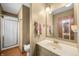 Bathroom with a single sink vanity and a stand up shower at 3210 Flintwood Dr, Columbus, IN 47203