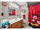 Bathroom with a Mickey Mouse theme, complete with a shower curtain and mirror at 3210 Flintwood Dr, Columbus, IN 47203