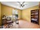 Bedroom with a desk area and a ceiling fan for comfortable working or relaxing at 3210 Flintwood Dr, Columbus, IN 47203