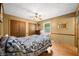 Cozy bedroom with a ceiling fan and hardwood floors at 3210 Flintwood Dr, Columbus, IN 47203